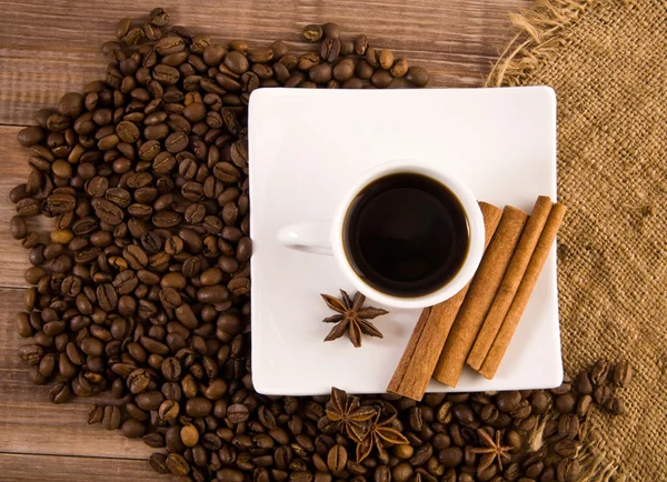 Cup of coffee and grain — Stock Photo, Image