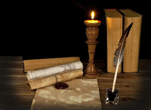 Old books with a candle — Stock Photo, Image