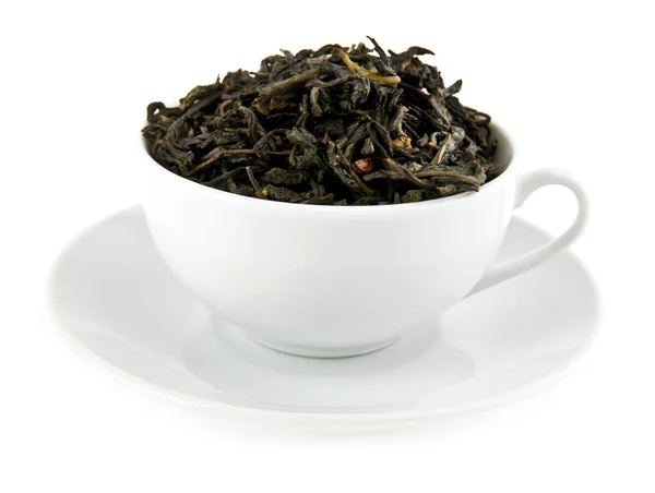 Black leaves tea in cup — Stock Photo, Image
