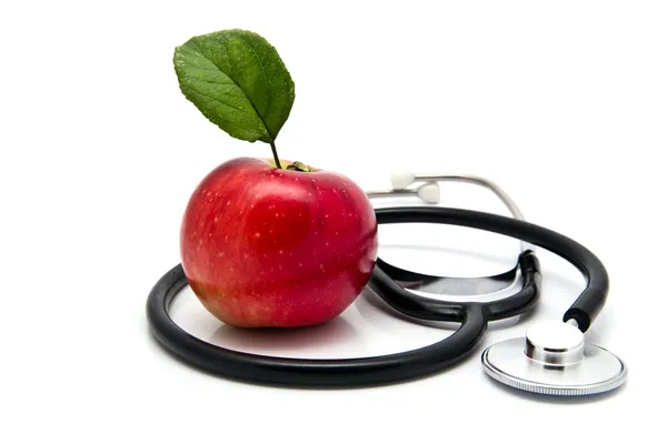 Jabłko i stetoskop Zdjęcia Stockowe bez tantiem