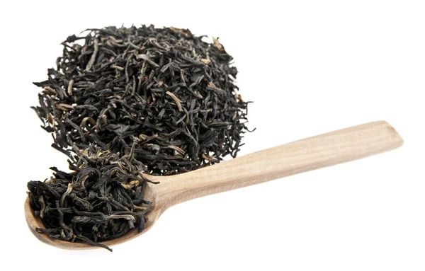 Té en una cuchara de madera — Foto de Stock