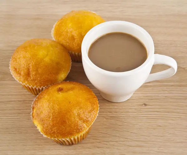 Cup of coffee and muffins — Stock Photo, Image