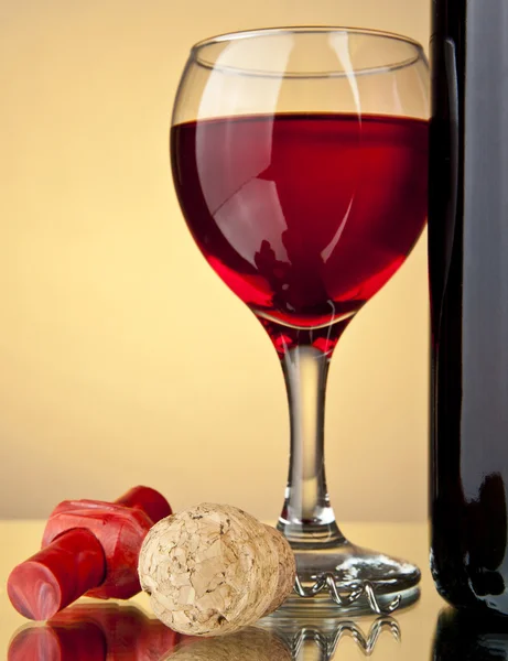 Glass of wine and a bottle — Stock Photo, Image