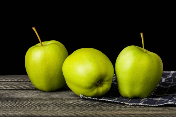 Green apples isolated on black background. Detail for Design. Design elements. Macro. Full Focus. Background for Business Cards, PostCards and Posters. Food Object Design.