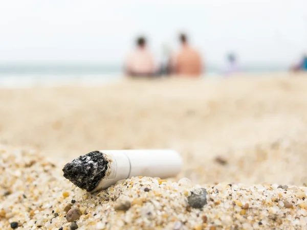 Cigarette butt on a beach — Stock Photo, Image