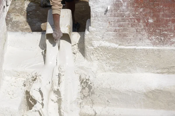 Man pouring whitewash — Stock Photo, Image