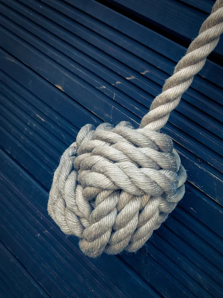 Nautical knot on blue background — Stock Photo, Image