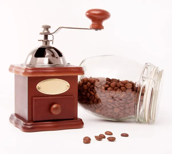 Wooden coffee grinder and coffee beans Stock Image