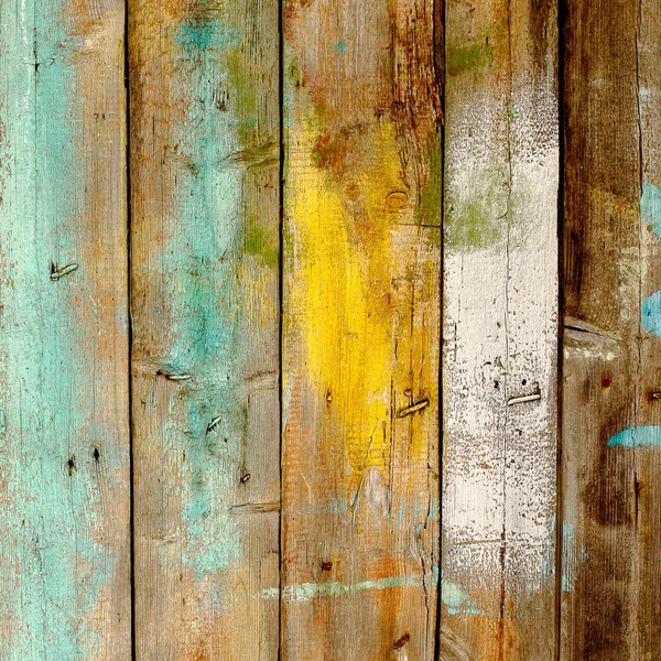Фон старий дерев'яний паркан, пофарбований в різні кольори — стокове фото