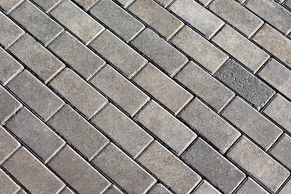 Grey tiles give a harmonic pattern at the ground — Stock Photo, Image