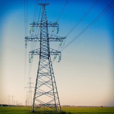 Electricity pylon against blue cloudy sky. Vintage clipart