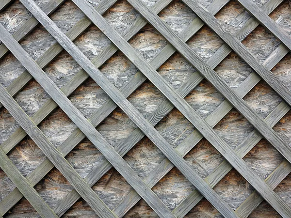 Stollenwand mit Holzlatten auf der Diagonalen — Stockfoto