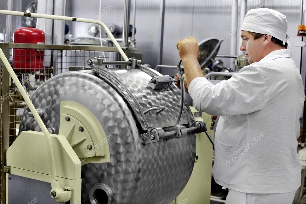 Worker on a milk factory — Stock Photo © ALesik 40965167