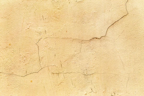 Hermosa pared vieja con grandes grietas y textura — Foto de Stock