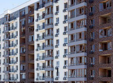 Broken windows of residential civilian building after Russian rocket exploded during Russian war against Ukraine. Broken glass windows, broken window frames from explosion. Russian invasion concept