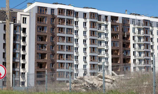 Broken windows of residential civilian building after Russian rocket exploded during Russian war against Ukraine. Broken glass windows, broken window frames from explosion. Russian invasion concept