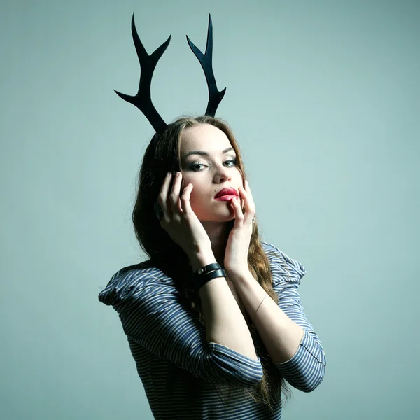 Fashion portrait of young beautiful woman with horn — Stock Photo, Image