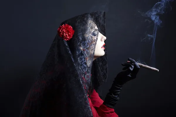 Smoking woman in black veil — Stock Photo, Image