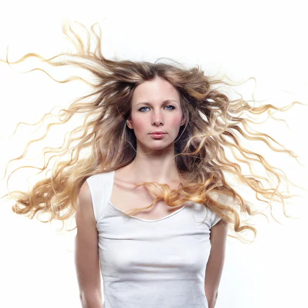 Portrait of a beautiful girl with flying blond hair — Stock Photo, Image