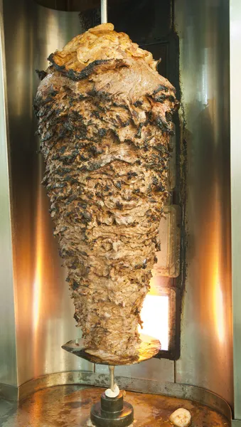 Large beef kebab on a spit roast — Stock Photo, Image