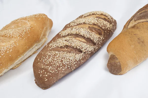 Selection of bread loaves on white — Stock Photo, Image