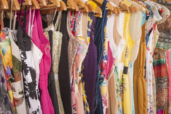 Womens clothes hanging on rail — Stock Photo, Image