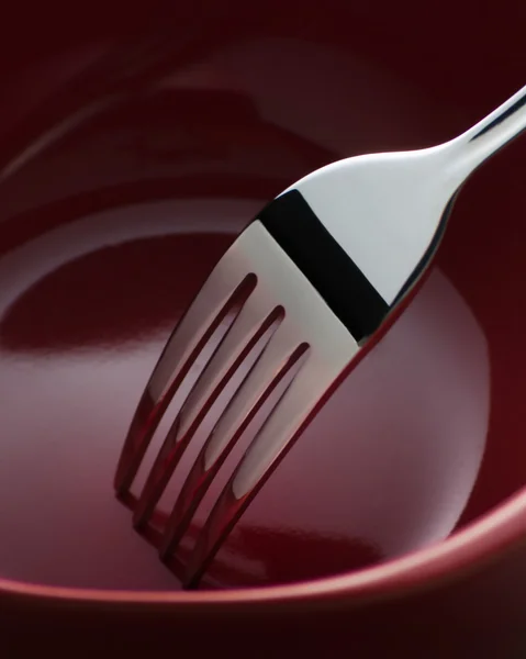 Fork in Dark Red Ceramic Dish — Stock Photo, Image