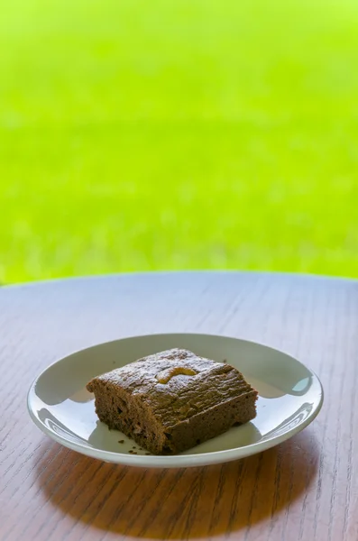 Chocolate cake in White Ceramic Dish — Stock Photo, Image