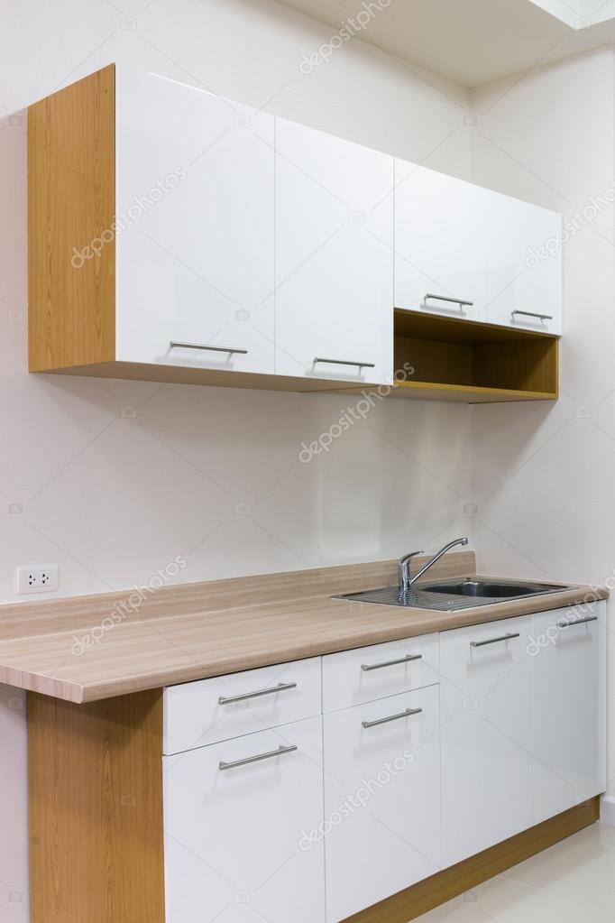 White and wood kitchen cabinet