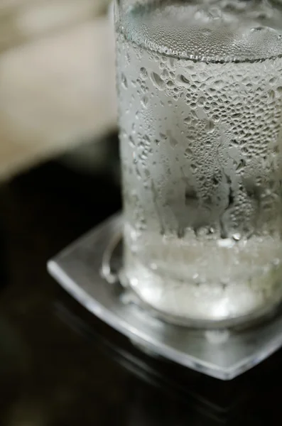 Glass of cool water with ice — Stock Photo, Image