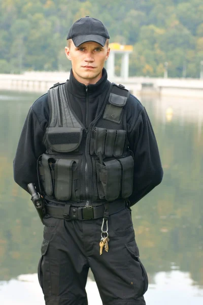 Security guard in uniform and armed — Stock Photo, Image