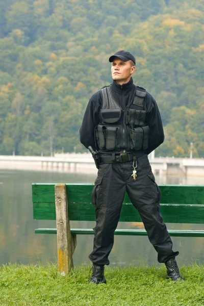 Security guard in uniform and armed — Stock Photo, Image