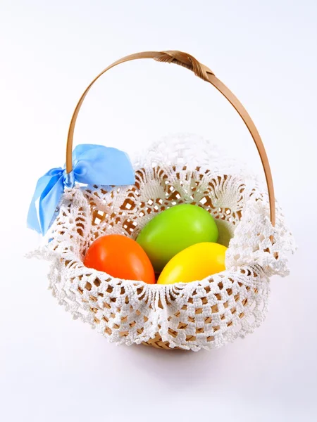 Easter eggs in basket on white background — Stock Photo, Image