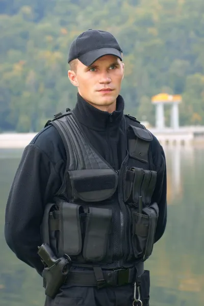 Security guard in uniform and armed