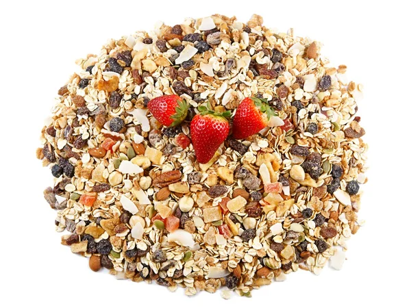 Cereales de desayuno y fresas, harina de avena con fresas, frutas confitadas, pasas y frutos secos, como fondo — Foto de Stock