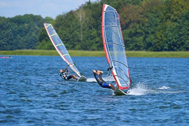 Windsurfing on the lake Nieslysz, Poland clipart