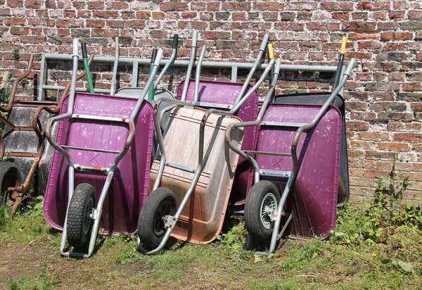 Collection Well Used Gardening Wheelbarrows — ストック写真