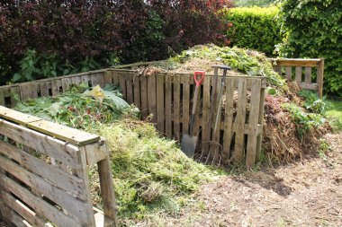Two Large Garden Compost Heaps in Wooden Frames.
