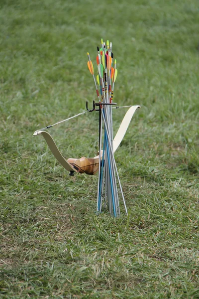 A Stand a Bow and Arrows of an Archery Sports Set.