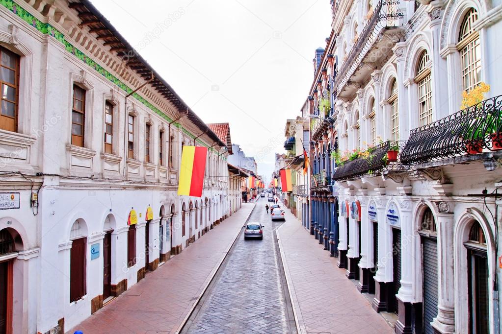 Streets of Cuenca Ecuador during the festivities with city flags