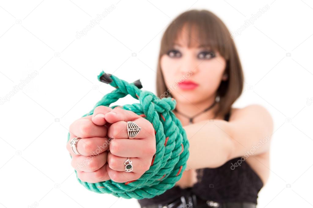 Woman in corset with hands tied focus on the front