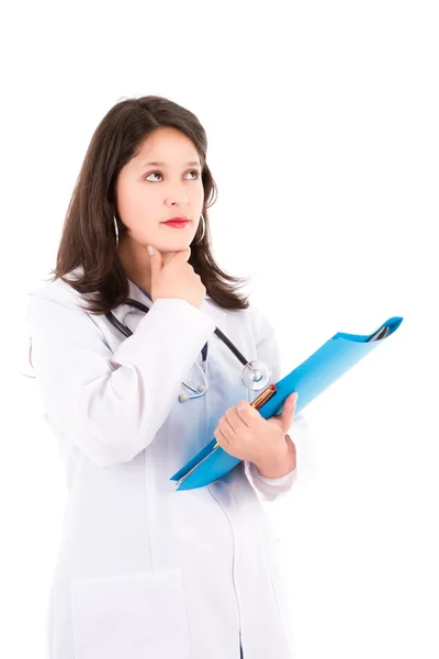 Friendly female doctor isolated on white thinking — Stock Photo, Image