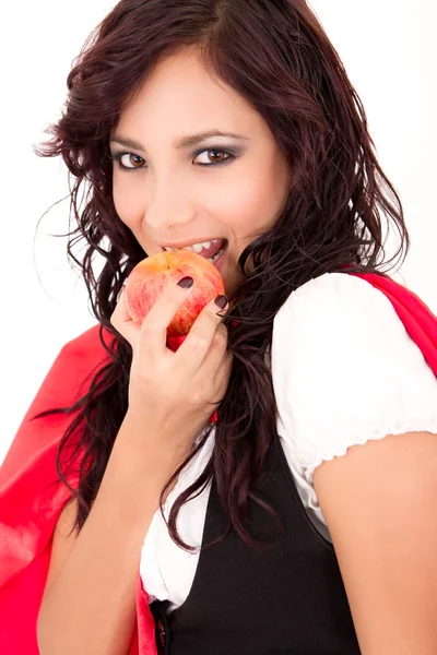 Kleine rode paardrijden kap eten van een appel — Stockfoto