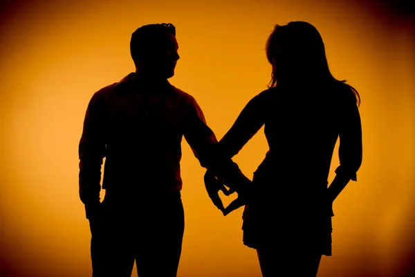 Couple silouette photography holding hands — Stock Photo, Image