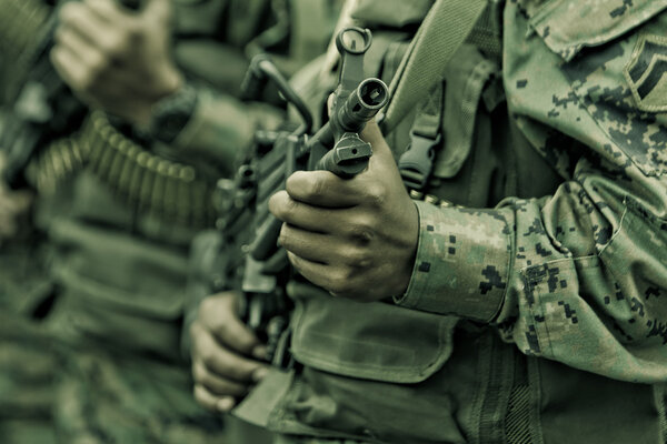 Young soldiers with guns