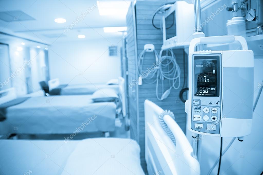 Blue tone of beds and machines in hospital, logos and trademarks removed