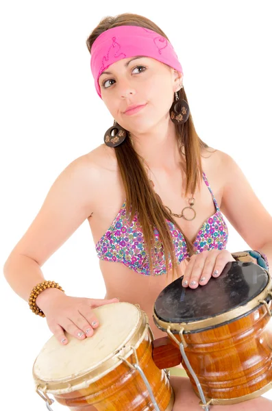 Beautiful woman playing bongos studio shot — Stock Photo, Image