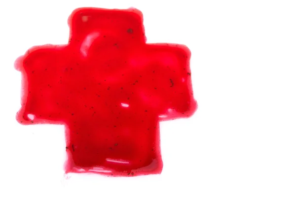 Red cross painted with finger — ストック写真