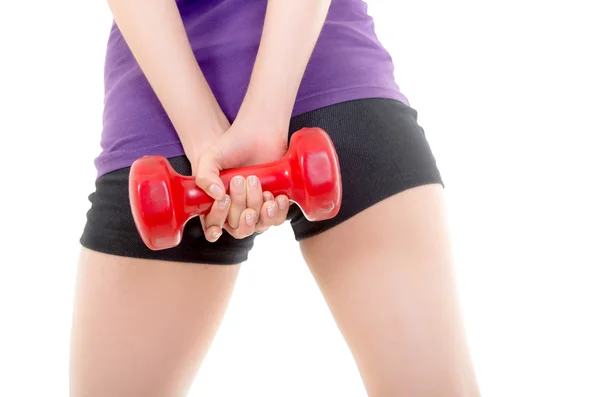 Mujer joven sosteniendo pesas durante el ejercicio —  Fotos de Stock