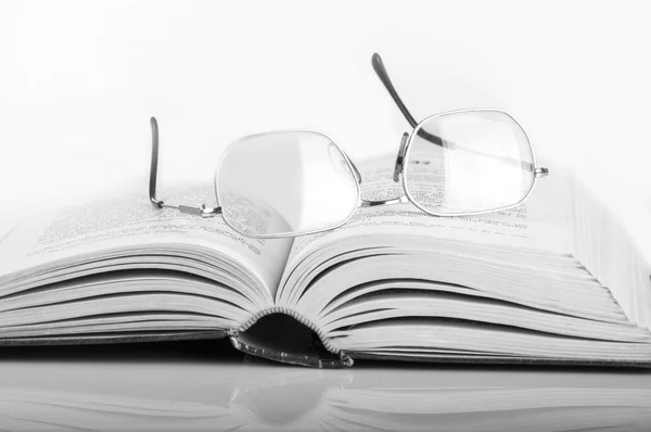 A pile of books and glasses — Stock Photo, Image